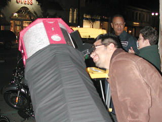 Visitors to Old Town Pasadena enjoy views of the first-quarter moon through Jane's 12.5-inch reflector telescope.